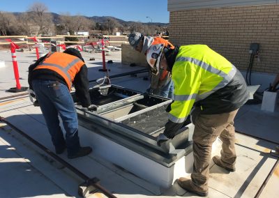 Men working on a curb adapter