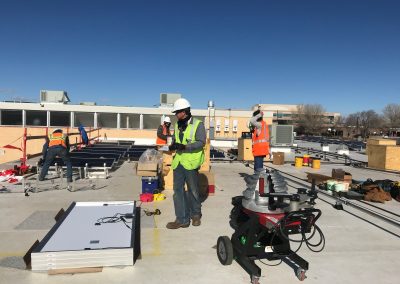 Men installing solar panels